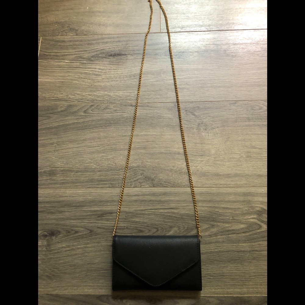 Black faux leather handbag that can be worn crossbody